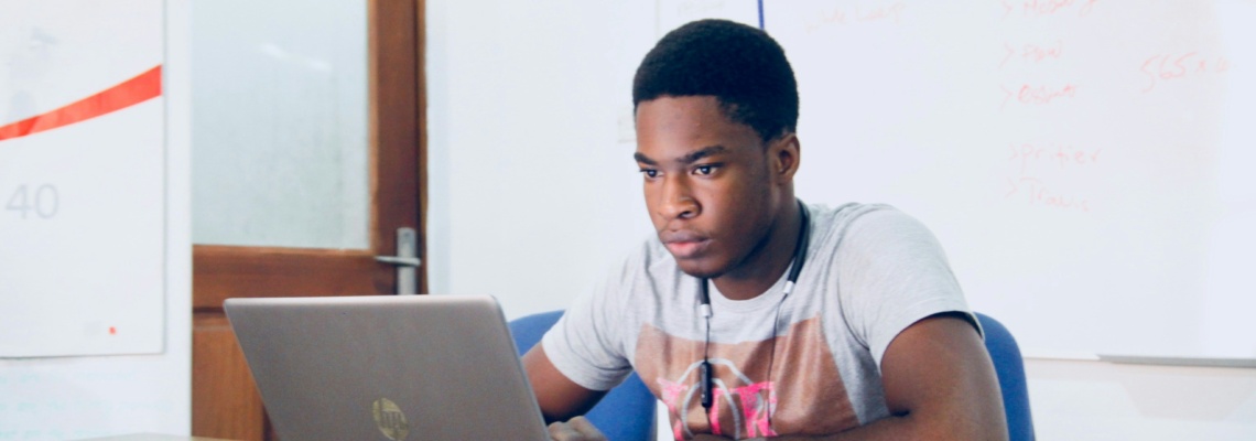 young man looking at a computer