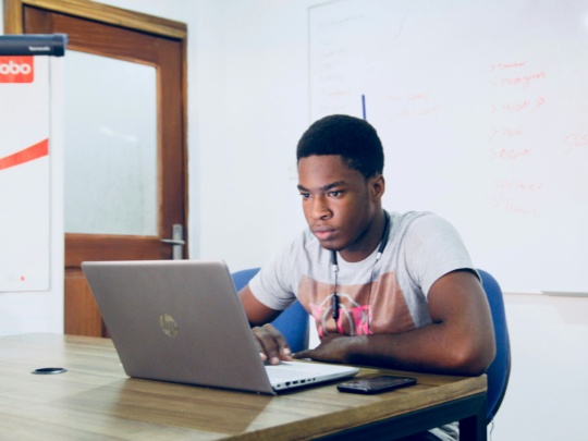 young man looking at a computer