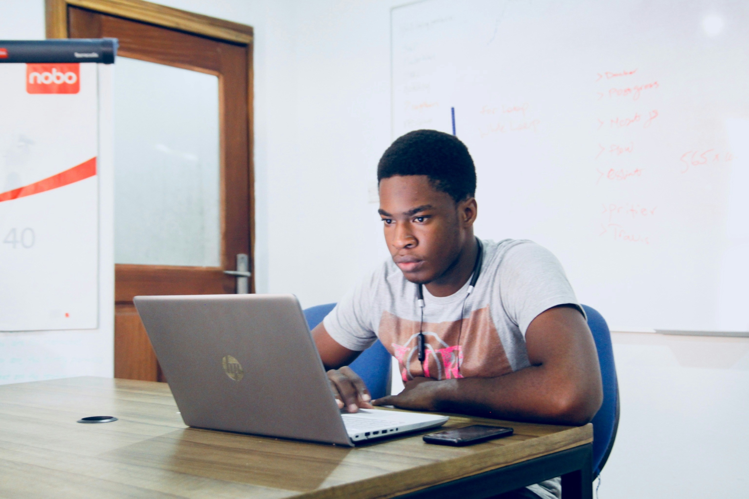 young man looking at a computer