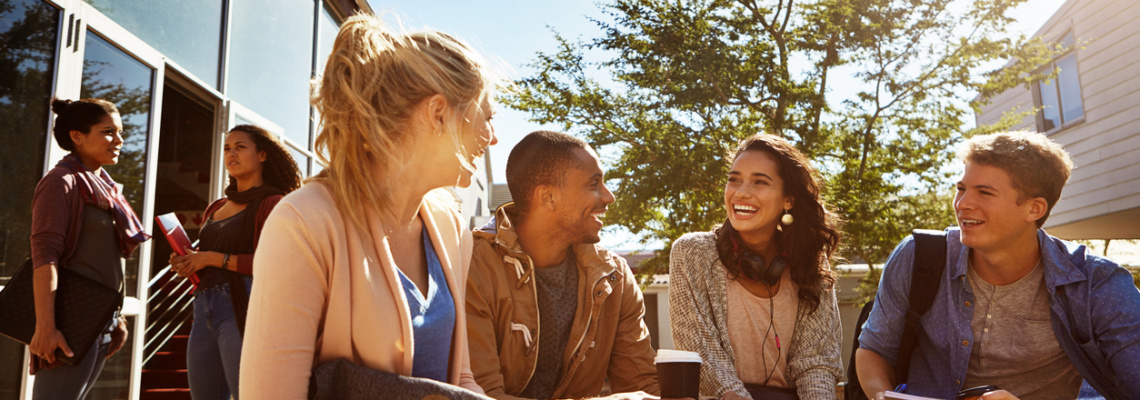 Shot of a group of students studying outside on campus