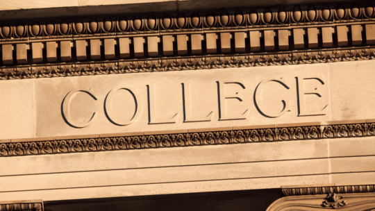 Stone building facade with ornate gold trim and the engraved word “COLLEGE” across a beige panel, framed by decorative columns and moldings.